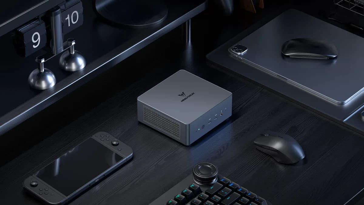 Minisforum HX99G - Vertical stand orientation showcasing aggressive carbon-fiber-accented gaming chassis
